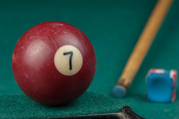 istock Billiards balls and cue on billiards table. Billiard sport concept 1215689719