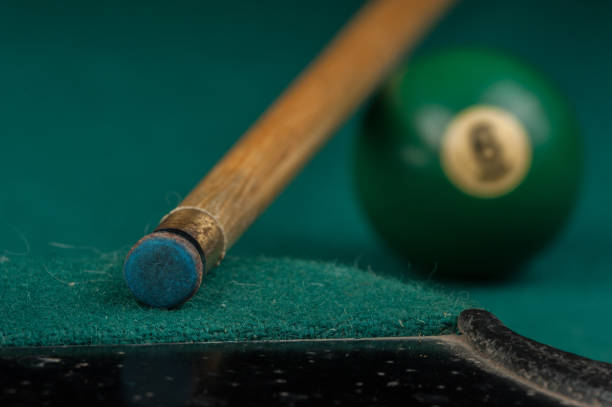 istock Billiards balls and cue on billiards table. Billiard sport concept 1215689781