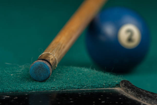 istock Billiards balls and cue on billiards table. Billiard sport concept 1215689837