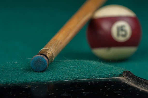 istock Billiards balls and cue on billiards table. Billiard sport concept 1215689947