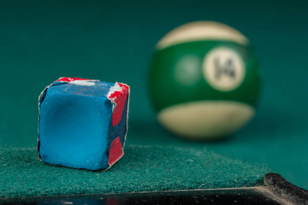 istock Billiards balls and cue on billiards table. Billiard sport concept 1215690185