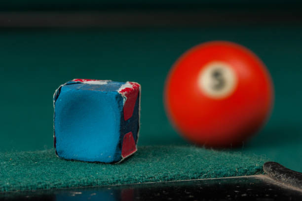 istock Billiards balls and cue on billiards table. Billiard sport concept 1215690276