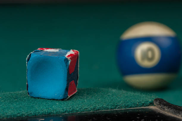 istock Billiards balls and cue on billiards table. Billiard sport concept 1215690317