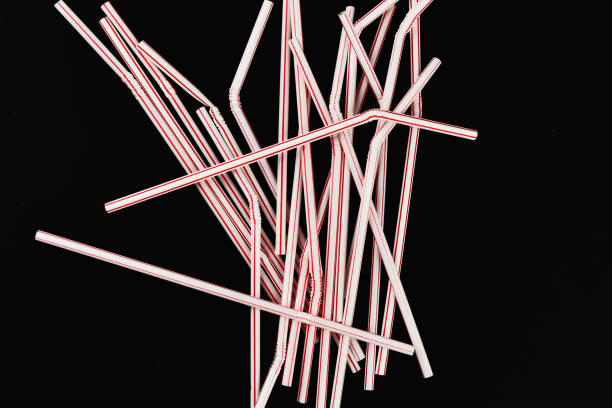 istock plastic tubules on a black background. randomly scattered. place for an inscription. view from above 1215691855