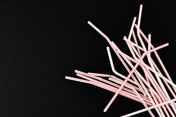 istock plastic tubules on a black background. randomly scattered. place for an inscription. view from above 1215694532