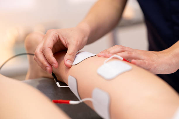 istock Electro stimulation in physical therapy to a young woman 1215695340
