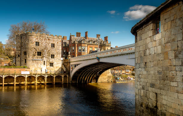 Lendal Bridge York Bridge in York, Yorkshire, United Kingdom at dawn blue skies white fluffy clouds river Ouse ouse river photos stock pictures, royalty-free photos & images