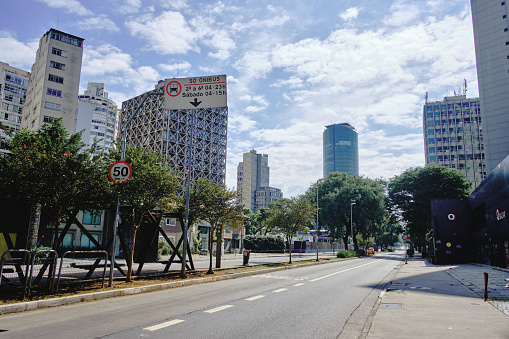 Empty Cidade Jardim Avenue with empty Bus Lane and sign during CoronaVirus Lockdown in March 2020.