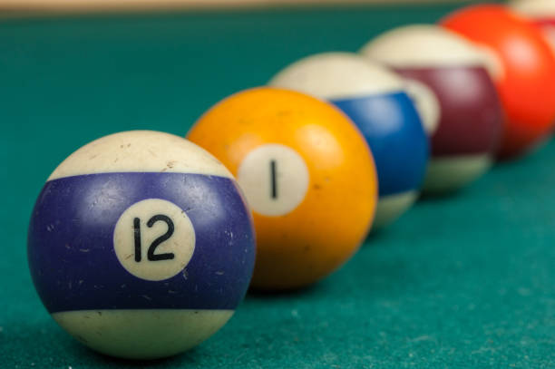 istock Billiards balls and cue on billiards table. Billiard sport concept 1215699063
