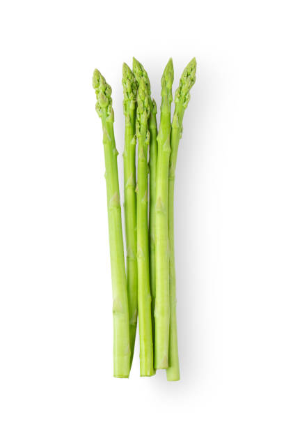 istock Asparagus isolated on white background. top view 1215699092
