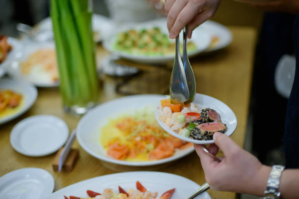 istock scooping the food, catering, dinner time 1215699206