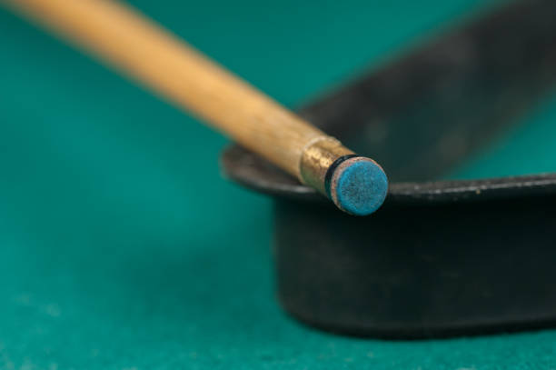 istock Billiards balls and cue on billiards table. Billiard sport concept 1215699272