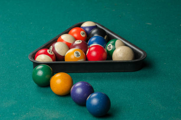 istock Billiards balls and cue on billiards table. Billiard sport concept 1215700103
