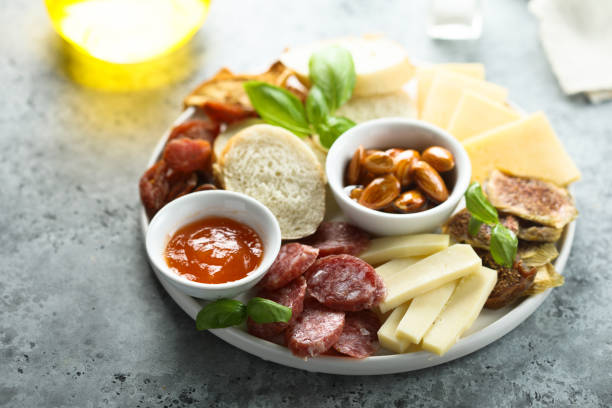 cheese and charcuterie platter - italian cuisine wine food pasta imagens e fotografias de stock