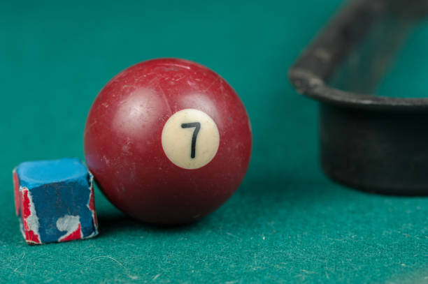 istock Billiards balls and cue on billiards table. Billiard sport concept 1215700458