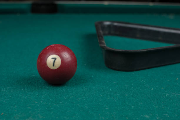 istock Billiards balls and cue on billiards table. Billiard sport concept 1215700528