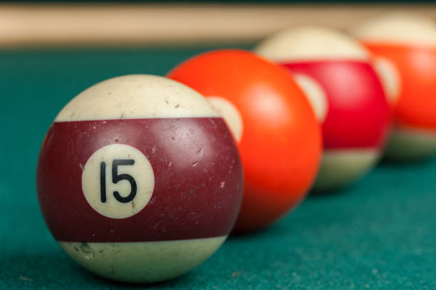 istock Billiards balls and cue on billiards table. Billiard sport concept 1215700538
