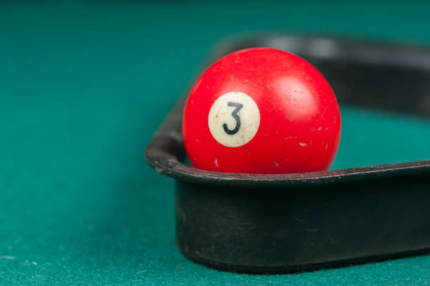 istock Billiards balls and cue on billiards table. Billiard sport concept 1215700583