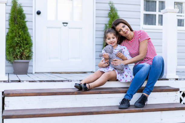 istock Mother and daughter having fun in back yard 1215700679