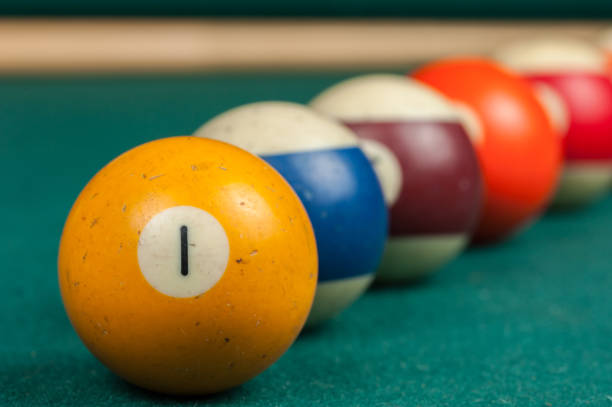 istock Billiards balls and cue on billiards table. Billiard sport concept 1215700758