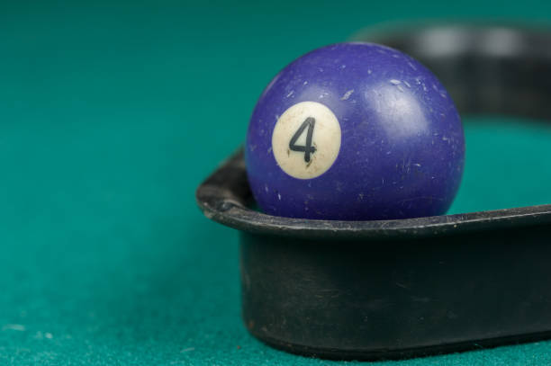 istock Billiards balls and cue on billiards table. Billiard sport concept 1215700895