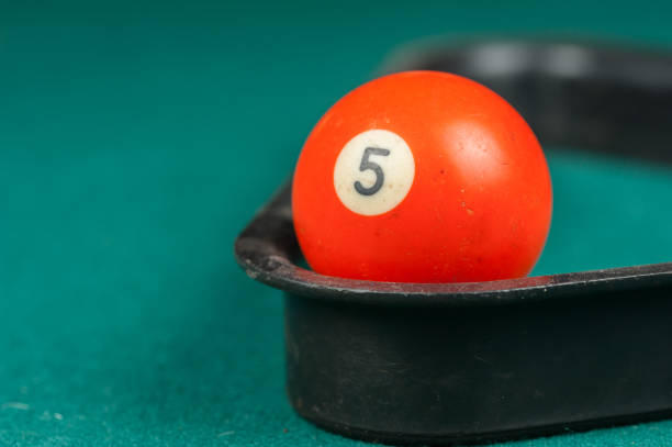 istock Billiards balls and cue on billiards table. Billiard sport concept 1215702472