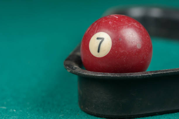 istock Billiards balls and cue on billiards table. Billiard sport concept 1215702475