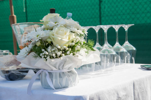 table with glasses and flowers during a catering service