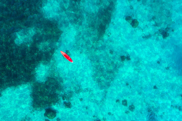 istock Clear turquoise seawater with Kayak boat 1215705431