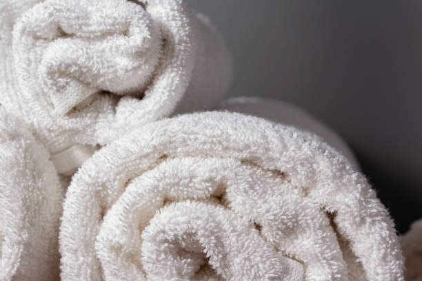 istock White terry towels in rolls at hotel. 1215707062