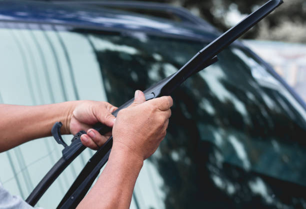 Mechanic replace windshield wipers on car. Replacing wiper blades Mechanic replace windshield wipers on car. Replacing wiper blades
Change cars wiper blades. Technician Man changing windshield wipers blades on car. windshield wiper photos stock pictures, royalty-free photos & images