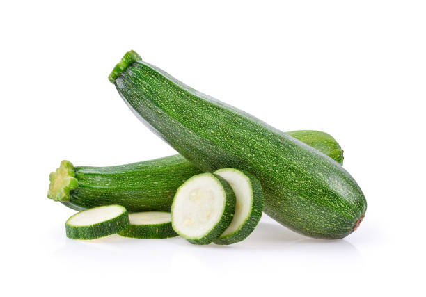 istock fresh green zucchini with slice isolated on white background 1215707652
