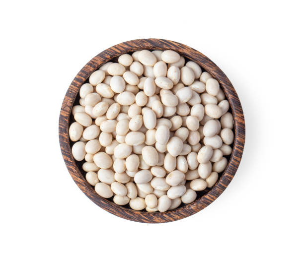 istock white beans in wood bowl isolated on white background. top view 1215707742