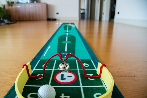 Miniature golf equipment set up in the living room to keep people entertained during the covid19 lockdown.