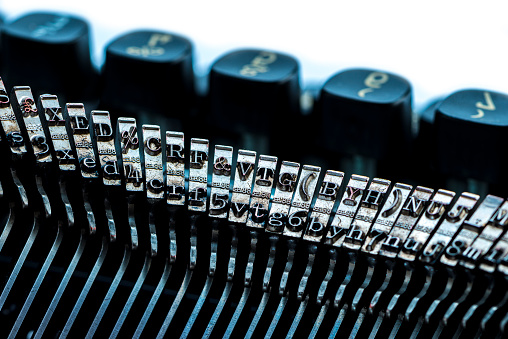 Vintage typewriter typebar, keys detail, selective focus