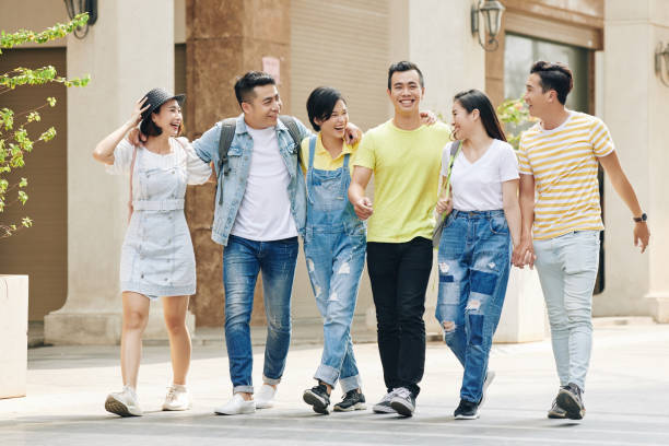 istock Happy students walking outdoors 1215709808