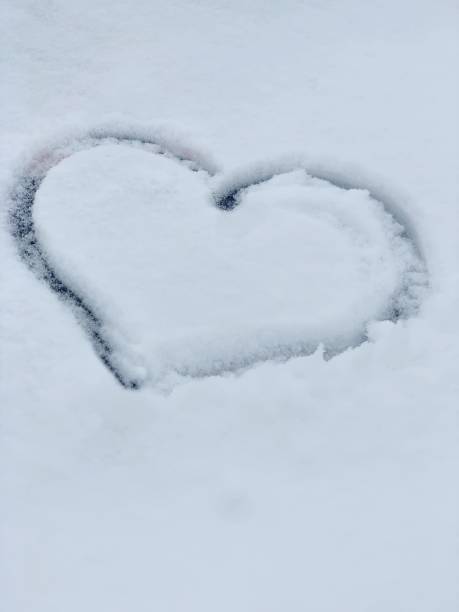 istock Heart in snow, winter and love 1215710668