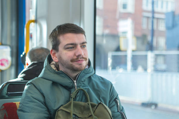 istock Young man in public transport. 1215711774