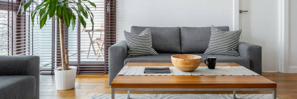 istock Gray couch in living room 1215713010