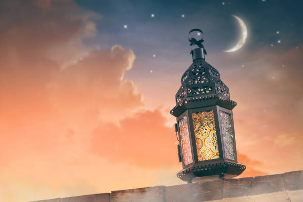 istock Ornamental Arabic lantern with burning candle 1215713684