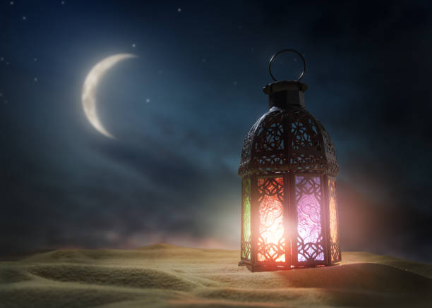 istock Ornamental Arabic lantern with burning candle 1215713688