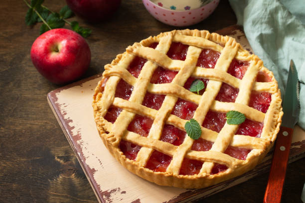 istock Homemade baking. Sweet apple pie on a rustic wooden table. Copy space. 1215714971