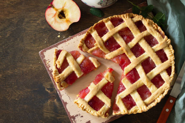istock Homemade baking. Sweet apple pie on a rustic wooden table. Top view flat lay background. Copy space. 1215714985