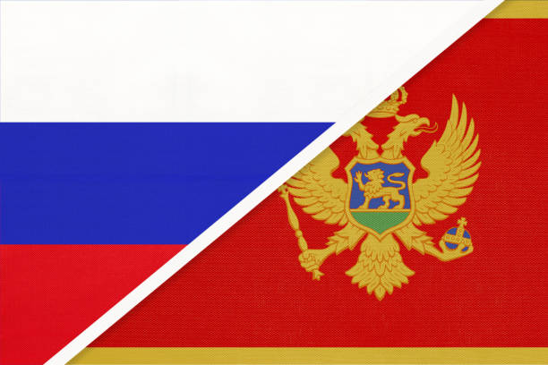 rusya - karadağ'ın ulusal bayrağı tekstilden. i̇ki ülke arasındaki ilişki ve ortaklık. - karadağ bayrağı stock illustrations
