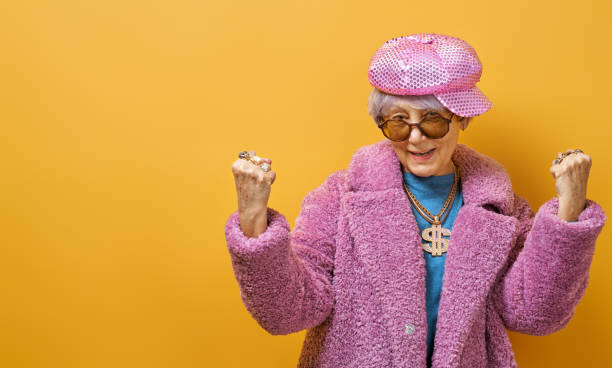 istock senior woman on color background 1215715432