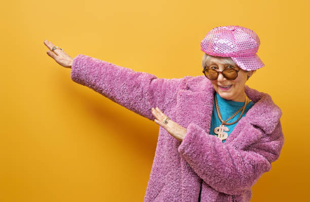 istock senior woman on color background 1215716811
