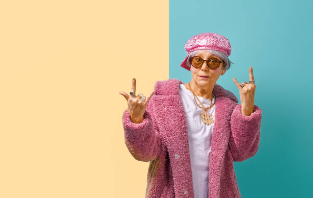 istock senior woman on color background 1215716936