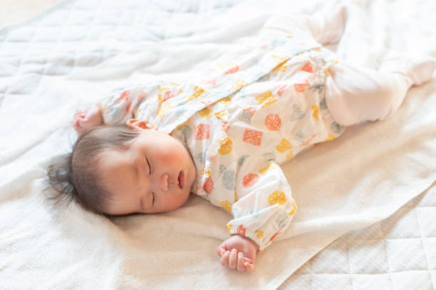 istock Cute baby sleeping soundly in a bright room 1215717292