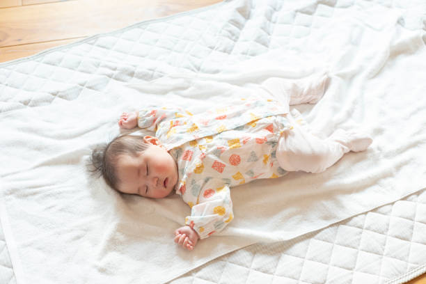 istock Cute baby sleeping soundly in a bright room 1215717345