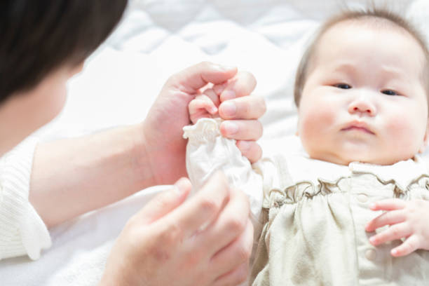 istock Dad comforting baby in bright room 1215718507
